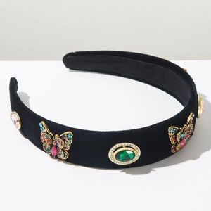Detailed view of luxury black velvet headband with sparkling rhinestone butterflies