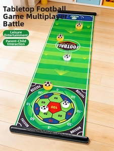Detail of a portable football game mat with scoring zones and sliding pucks for kids