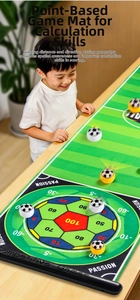 Close-up of a portable tabletop football scoring mat with circular point zones and game balls