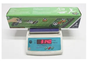 Weight measurement of the portable football tabletop game box showing 314 grams