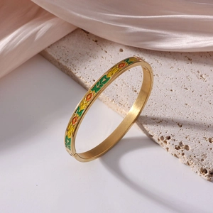 6mm titanium steel enamel bangle with 18K gold plating on textured stone and silk