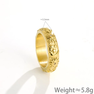 Golden titanium steel ring with embossed sun and moon motifs featuring zircon inlay