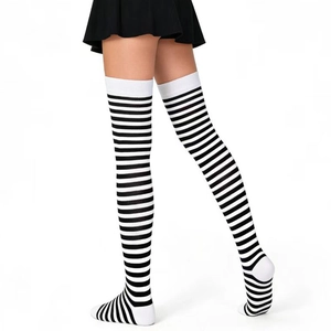 Detail of black and white striped over-knee socks with white elastic cuffs for costumes