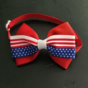 Detail of Independence Day pet bowtie with patriotic star and stripe pattern ribbon