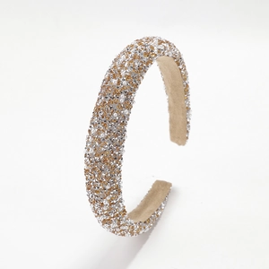 Luxurious wide padded headband with sparkling rhinestones and pearls on white background