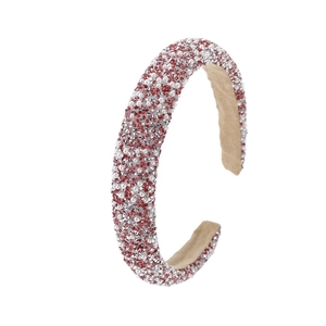 Padded headband with red and white pearls and rhinestones on a white background