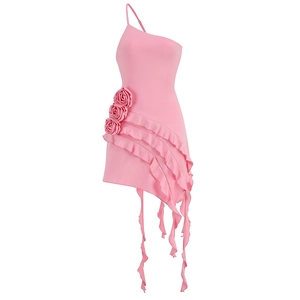 Detail of pink one-shoulder mini dress featuring 3D handmade roses and ruffled hemline