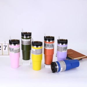 Detailed view of insulated stainless steel tumblers in multiple colors with 3-way lid design