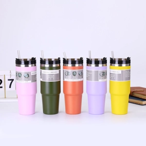 Detail of multi-color 20oz and 30oz vacuum insulated stainless steel tumblers with straws