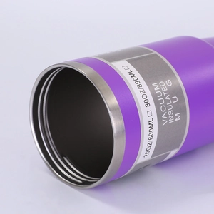 Detail view of purple stainless steel vacuum insulated tumbler with capacity spec label