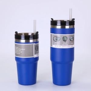 Detail view of dual-size blue insulated tumblers with 3-way lids and stainless steel bodies