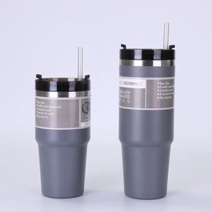 Close-up of matte grey 30oz vacuum insulated tumblers with lids and straws