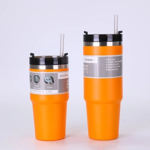 Detail of orange 20oz and 30oz vacuum insulated stainless steel tumblers with lids