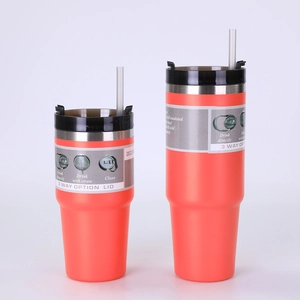 Detail of 20oz coral orange insulated tumbler with 3-way lid and clear straw