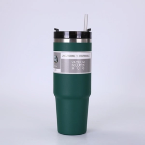 Detailed view of dark green 20oz and 30oz vacuum insulated tumblers with lids and straws