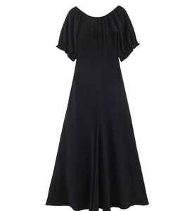 Close-up of the pleated U-neckline and elastic puff sleeves on this black midi dress