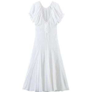 White midi dress with puff sleeves, open back and bow tie details for a romantic look