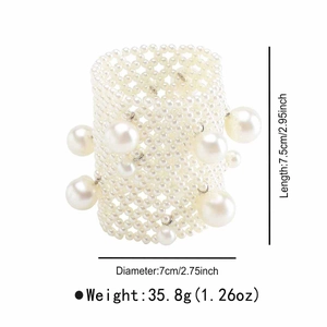 Detail view of woven pearl cuff bracelet with dimensions 7.5cm length and 7cm diameter
