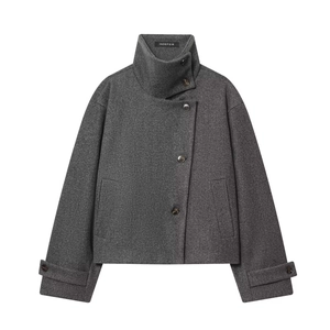 Detailed view of high stand collar and asymmetrical single-breasted button closure jacket