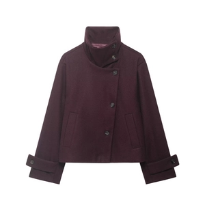 Detail view of burgundy wool coat showing high stand collar and asymmetric buttons