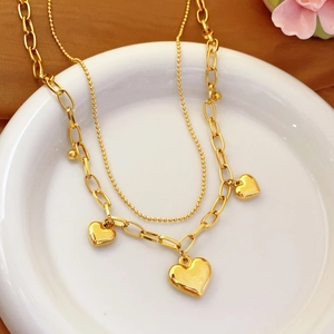 Double-layered gold-plated stainless steel chain bracelet with heart-shaped pendants