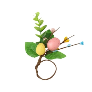 Easter napkin ring with colorful eggs and green eucalyptus leaves on brown vine base