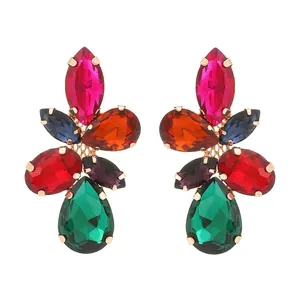 Detail of leaf-shaped earrings with colorful faceted glass gemstones in gold-tone plating