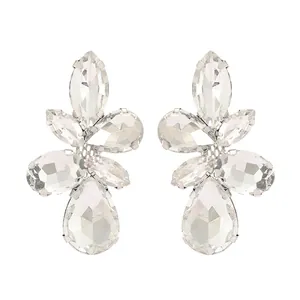 Detailed view of leaf shaped glass gemstone earrings with sparkling crystal clusters
