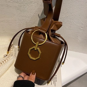 Retro dark brown leather bucket bag with gold hardware and drawstring closure for women