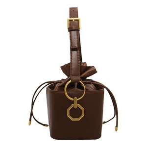 Retro brown leather drawstring bucket bag with gold ring hardware and adjustable strap