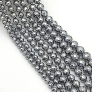 Polished 128-facet terahertz gemstone beads in various sizes with deep metallic grey finish