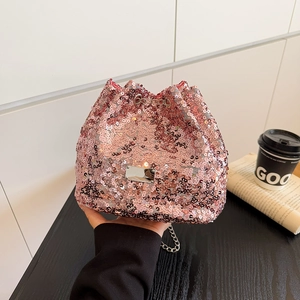 Detailed view of pink sequin bucket bag with metal chain strap and drawstring closure