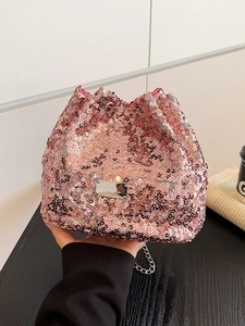 Chic pink sequin bucket bag with silver chain strap and shiny metallic finish