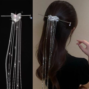 Silver heart hair pin with cascading rhinestone tassels shown on model for back view styling