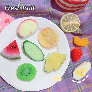 Detailed assortment of resin fruit charms including slices of lemon watermelon and strawberry