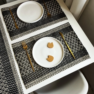 Macro detail of rectangle black and white woven placemat with modern nordic textures