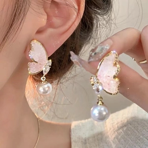 Elegant gold butterfly earrings with pink crystal wings and white dangling pearls