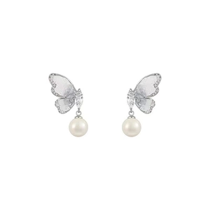 Detail of silver butterfly earrings with sparkling crystals and elegant white pearls