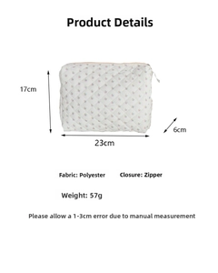 Detailed product specifications and size chart for the quilted floral makeup pouch