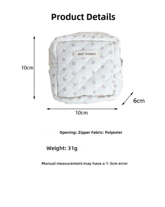 Detailed view of quilted floral cosmetic bag with dimensions and fabric info