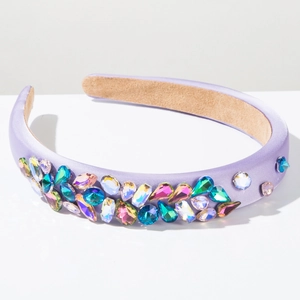 Macro detail of lavender satin headband with dense colorful multi-cut gemstones decoration