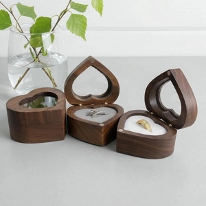 Heart-shaped walnut wood ring box with clear window and plush interior for wedding jewelry