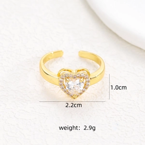 Detail of adjustable gold ring with a large heart zircon and small pavé diamonds