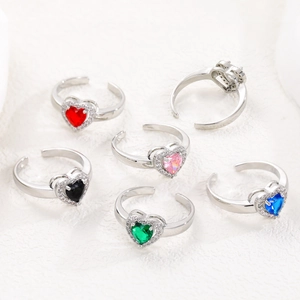 Macro detail of adjustable heart rings with colorful zircon stones in various shades