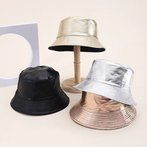 Detail view of stylish PU leather bucket hats in metallic gold, silver, rose gold and black