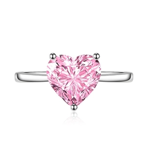 Elegant heart-shaped pink zircon ring with polished silver open band on white background