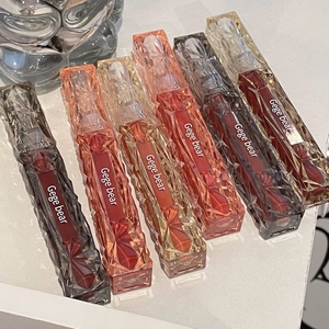 Set of six glossy diamond-cut lip glazes in various shades including wine and coral