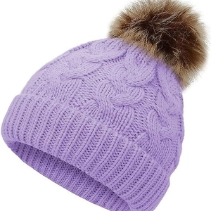 Winter cable knit baby beanie in lavender purple featuring a large faux fur pom-pom topper