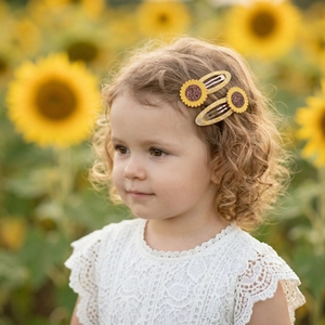 Cute sunflower hair clips for girls with yellow checkered fabric and glitter detail