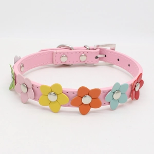 Close-up of pink PU leather dog collar with colorful 3D leather flower decorations